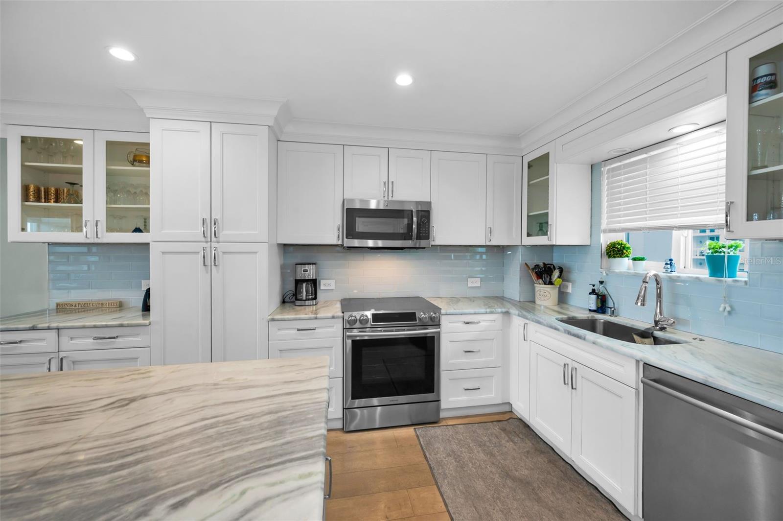Gorgeous updated kitchen with large quartz island