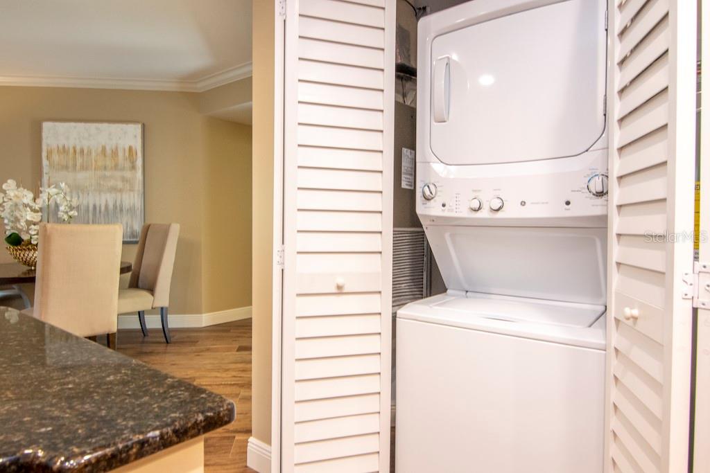 A dedicated in-unit laundry closet adds convenience and ease to your routine.