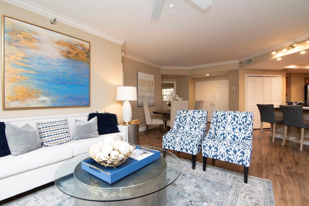 Recent tasteful upgrades include gorgeous new flooring, smooth ceilings, crisp crown and base moldings, new interior doors and hardware, fresh window treatments, and contemporary light fixtures-delivering a turnkey presentation with thoughtful designer touches.