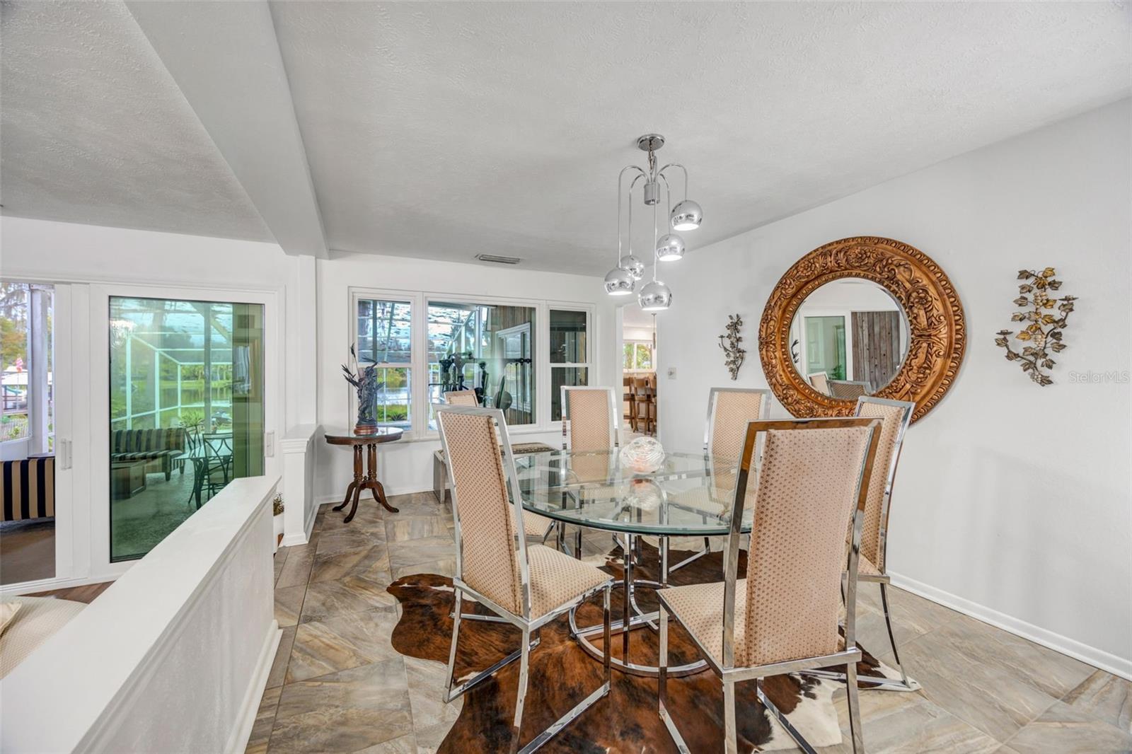 Formal dining room looks out to your pool