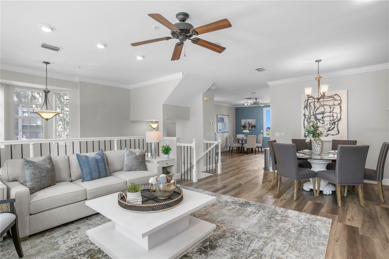 The spacious living and dining areas flow into a beautifully updated eat-in kitchen withstainless steel appliances, abundant cabinetry, and a welcoming island.