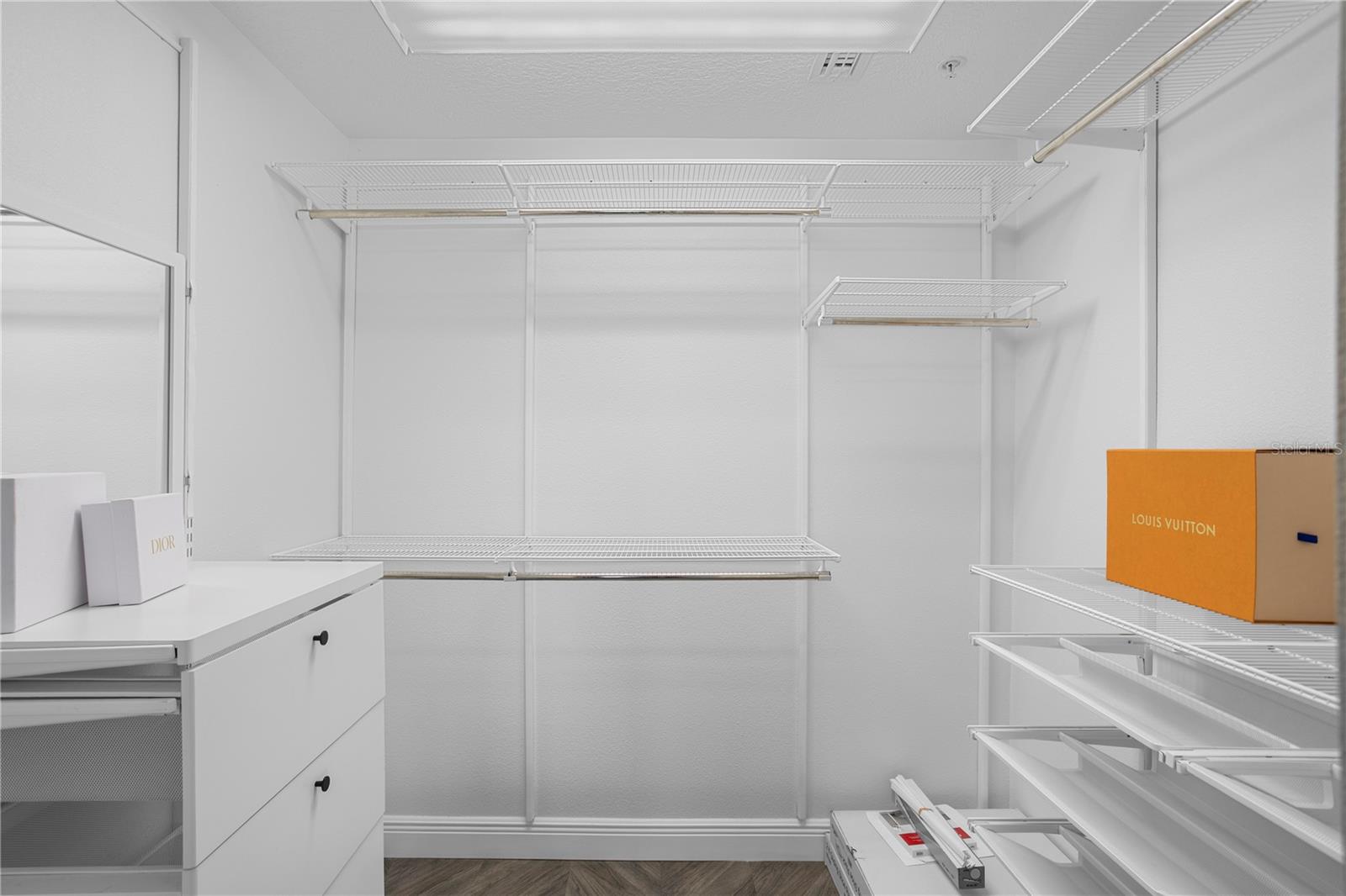 The custom walk-in closet in the primary retreat