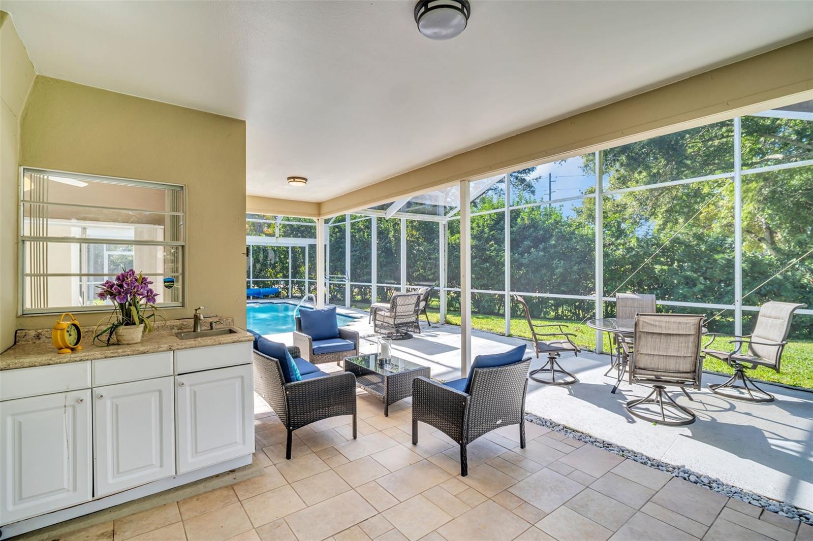 Outdoor sink, food prep counterspace, & cabinetry with window passthrough~