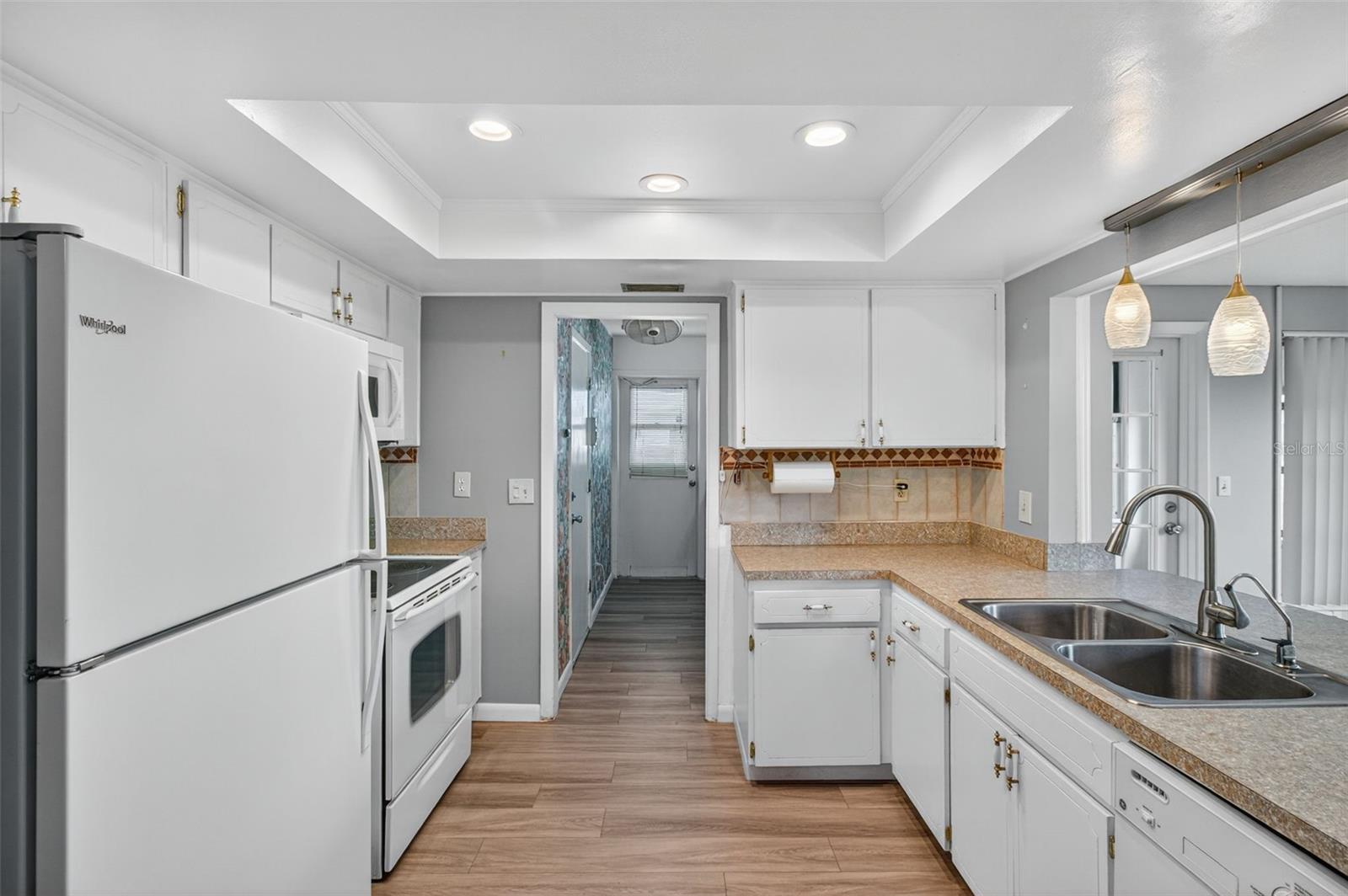 Kitchen and Laundry Room with newer luxury vinyl flooring