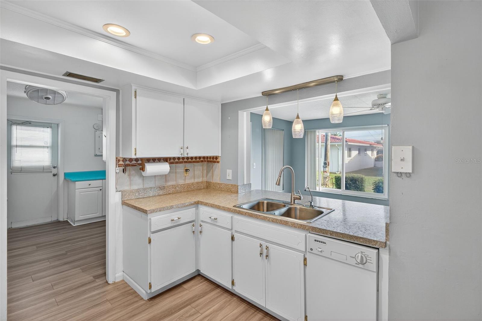 Kitchen counter area overlooks Family Room.  Enter Laundry Room from Kitchen.