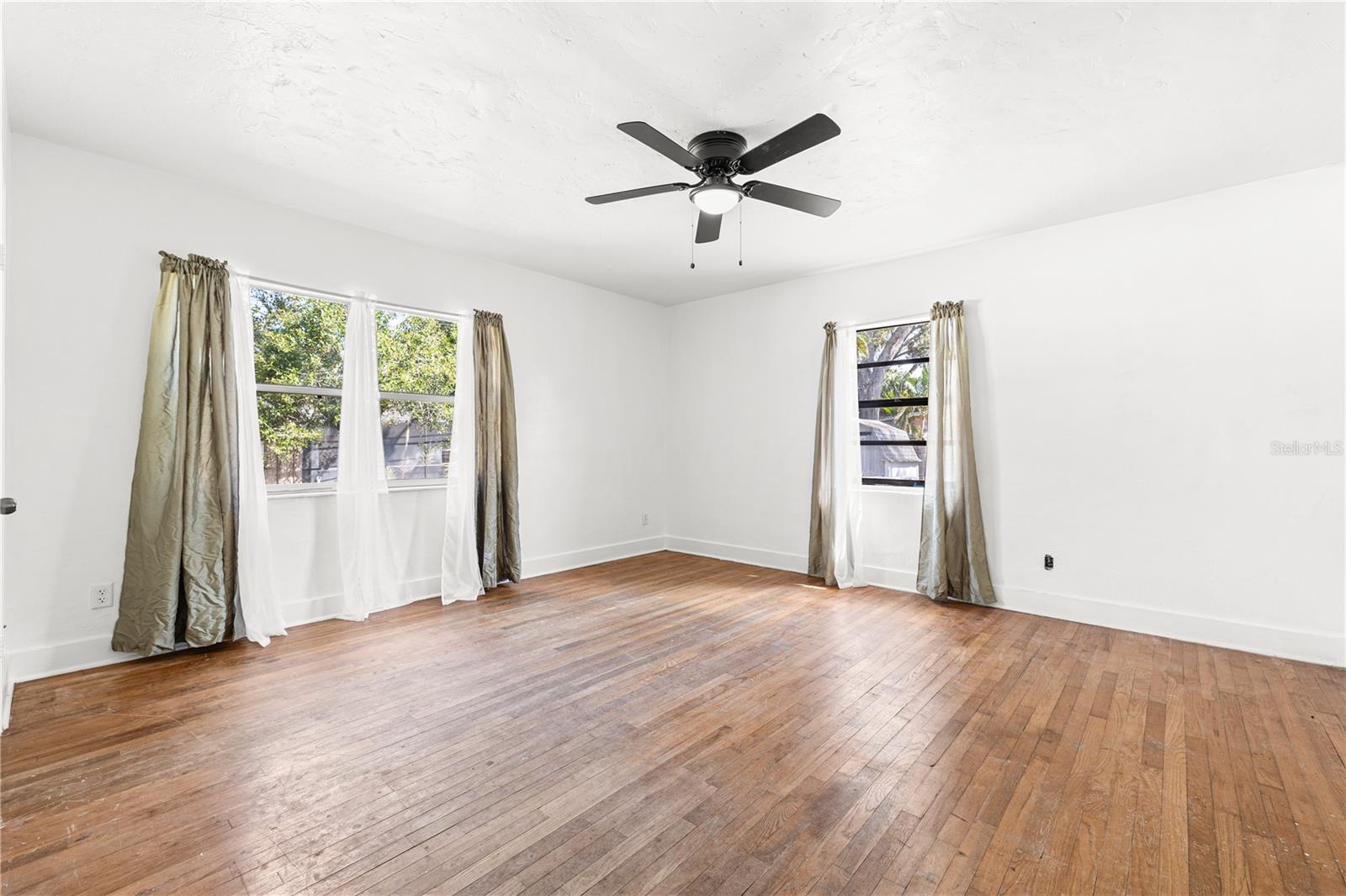 Second spacious primary suite towards the back of the home