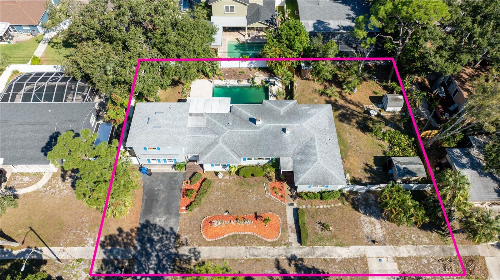 This expansive home sits across 2 3/4 lots, just under half an acre, on the West side of Park St.