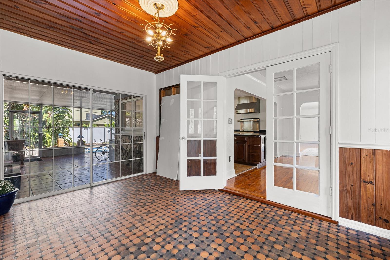 Nostalgic, hexagonal "penny" tile lines the entryway on the West wing of the home.