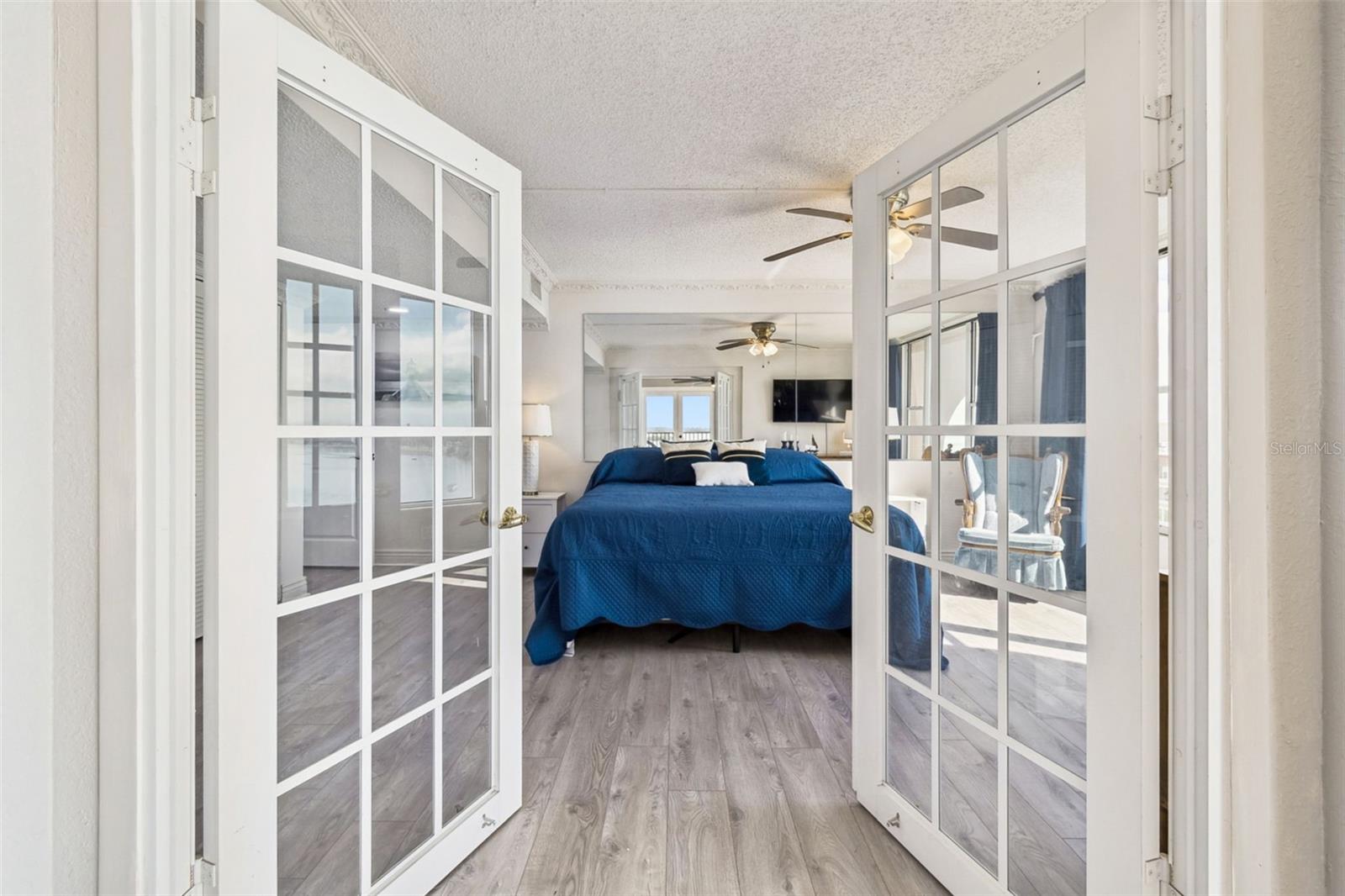 French doors open from living area to 3th. bedroom