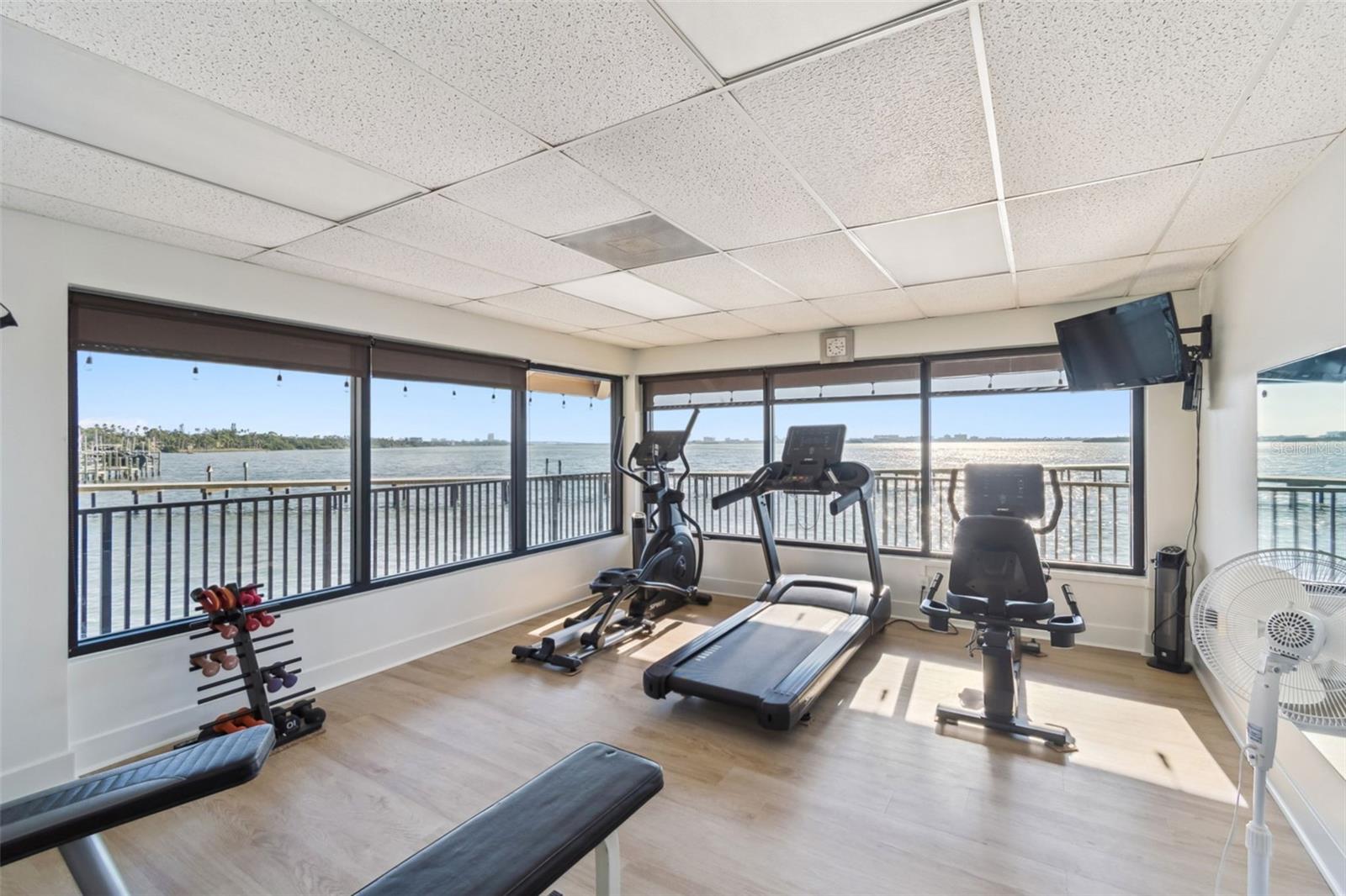 Clubhouse gym with expansive waterview