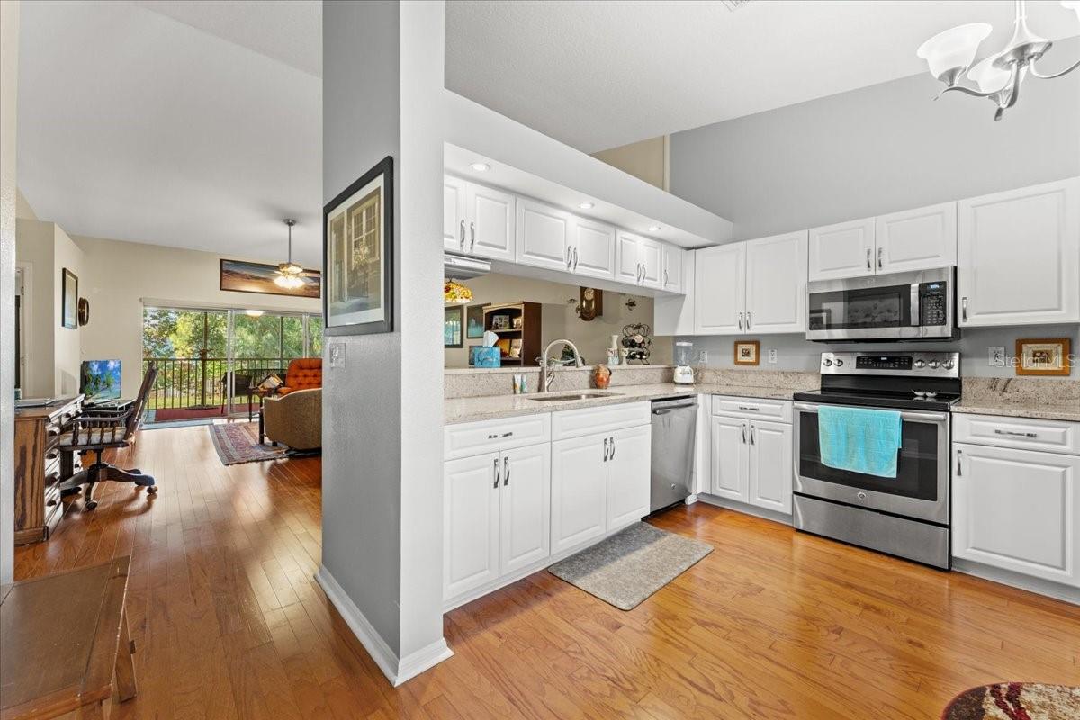 The lovely engineered wood flooring runs through out the living spaces