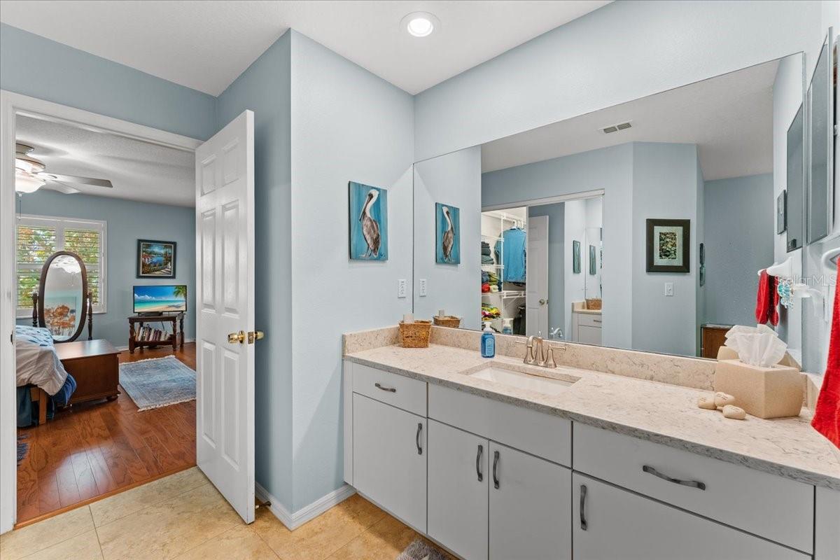 A view of the Bath, looking toward the Primary Bedroom