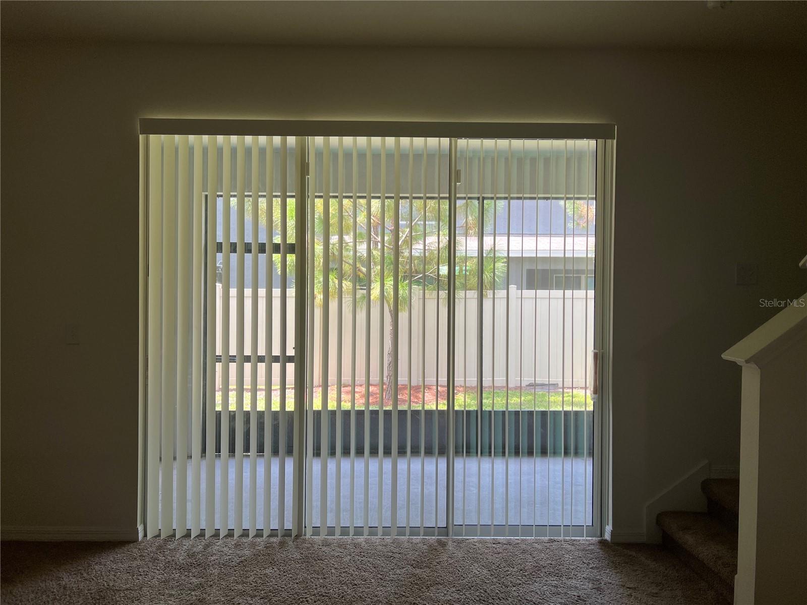 Sliding doors leading to the enclosed lanai.