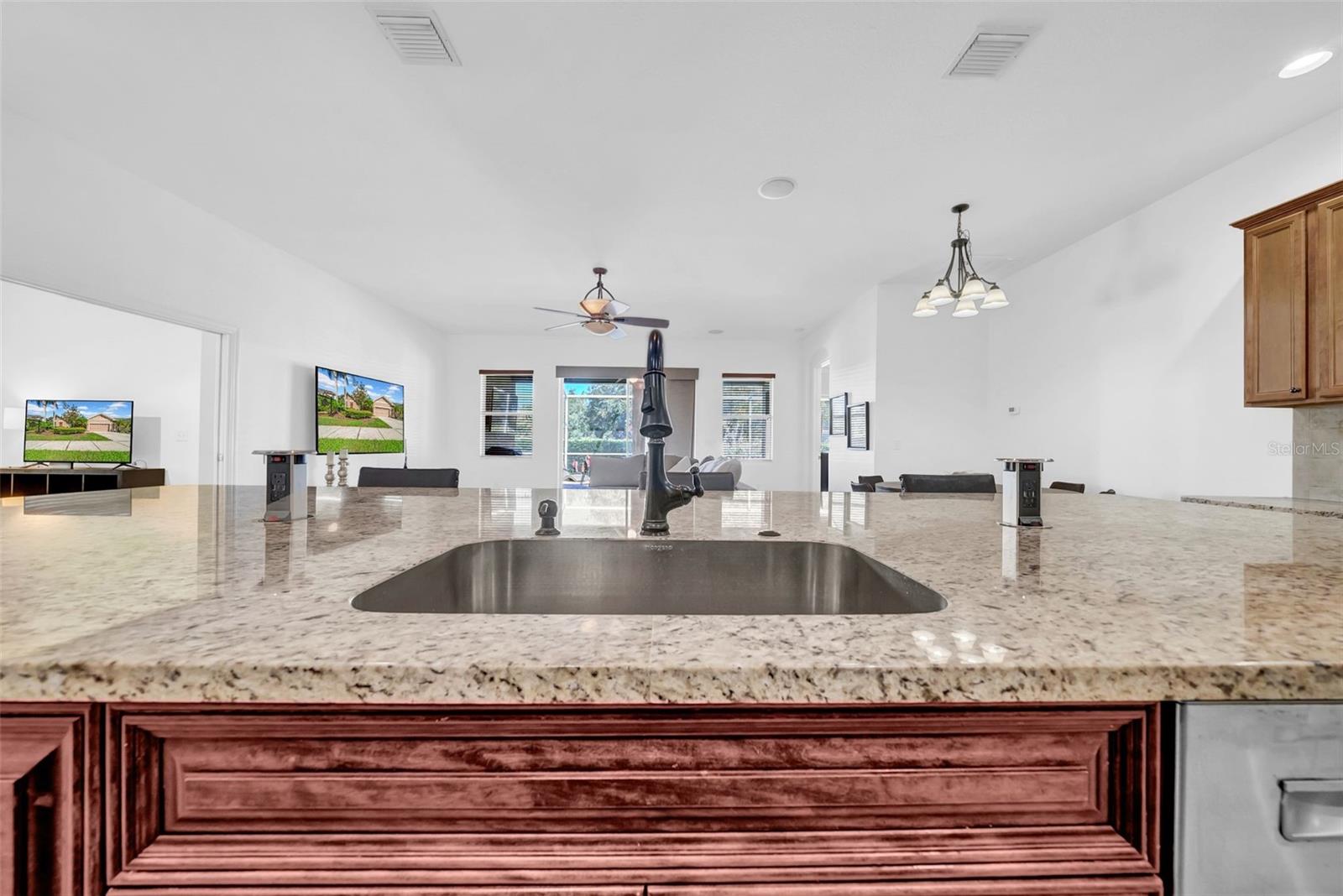 Pop-up charging stations in kitchen island.