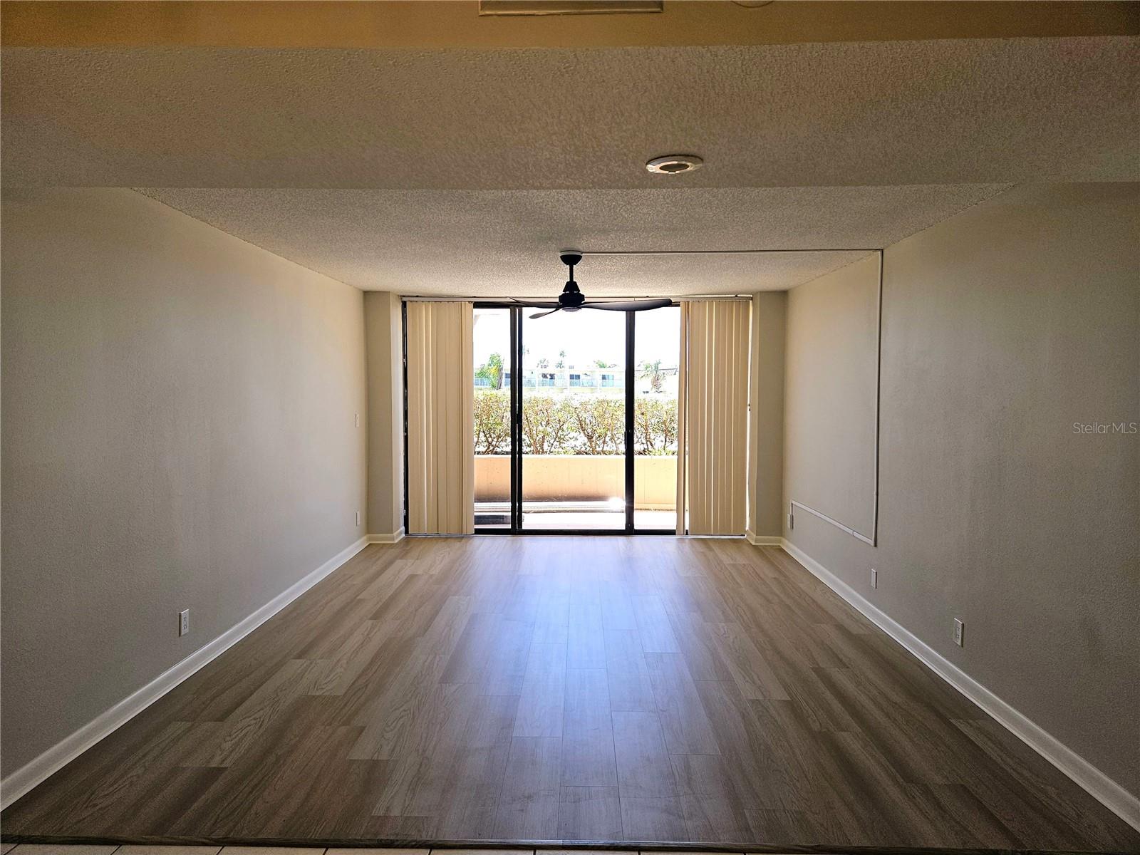 Great Room with Sliders Out to Patio