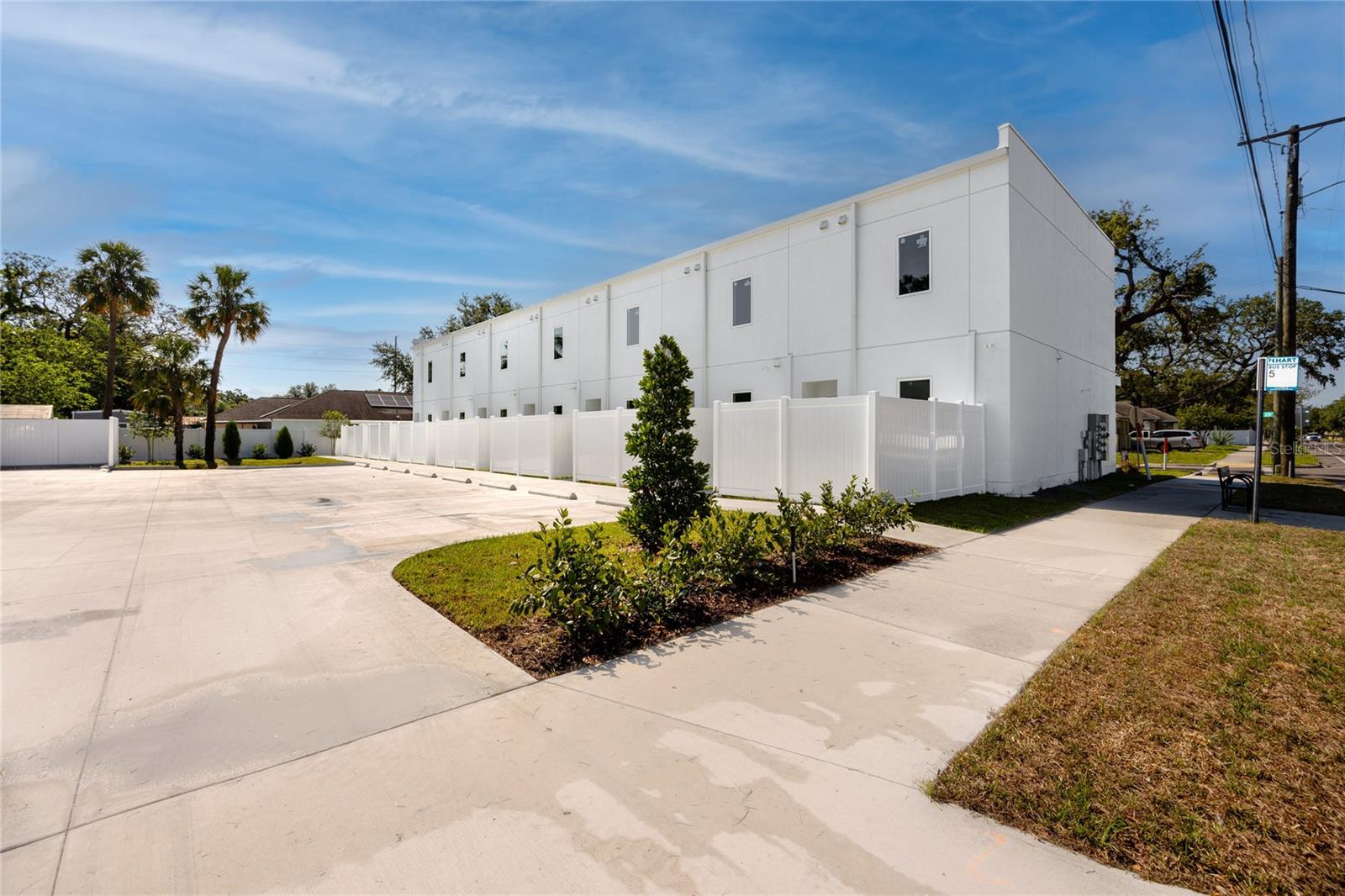 Large parking pad with two assigned parking spaces & guest parking