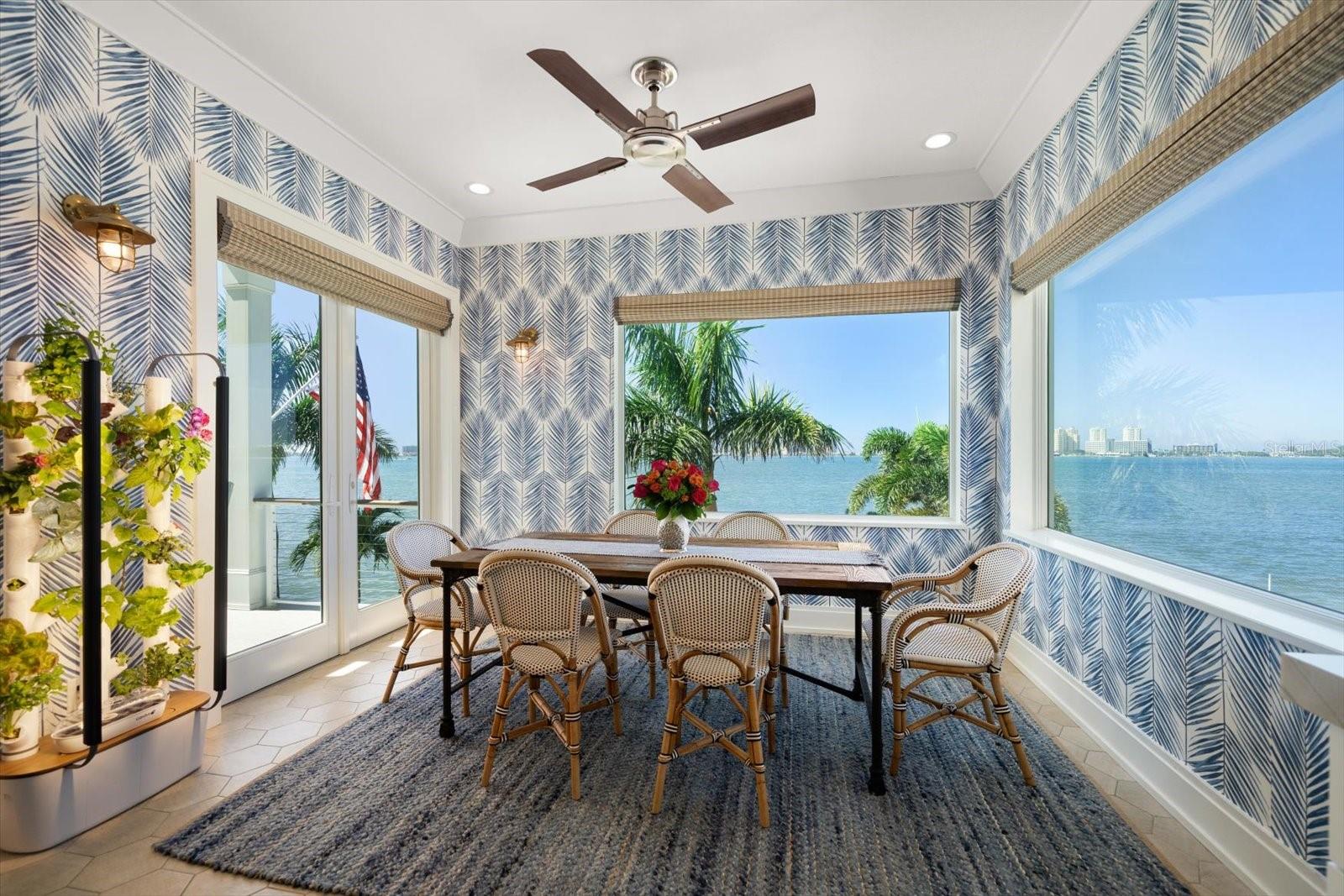 The breakfast room is surrounded by views of the water