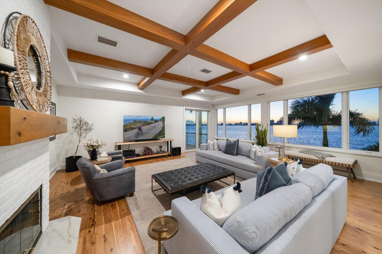 Great room with coffered ceilings and a gas fireplace