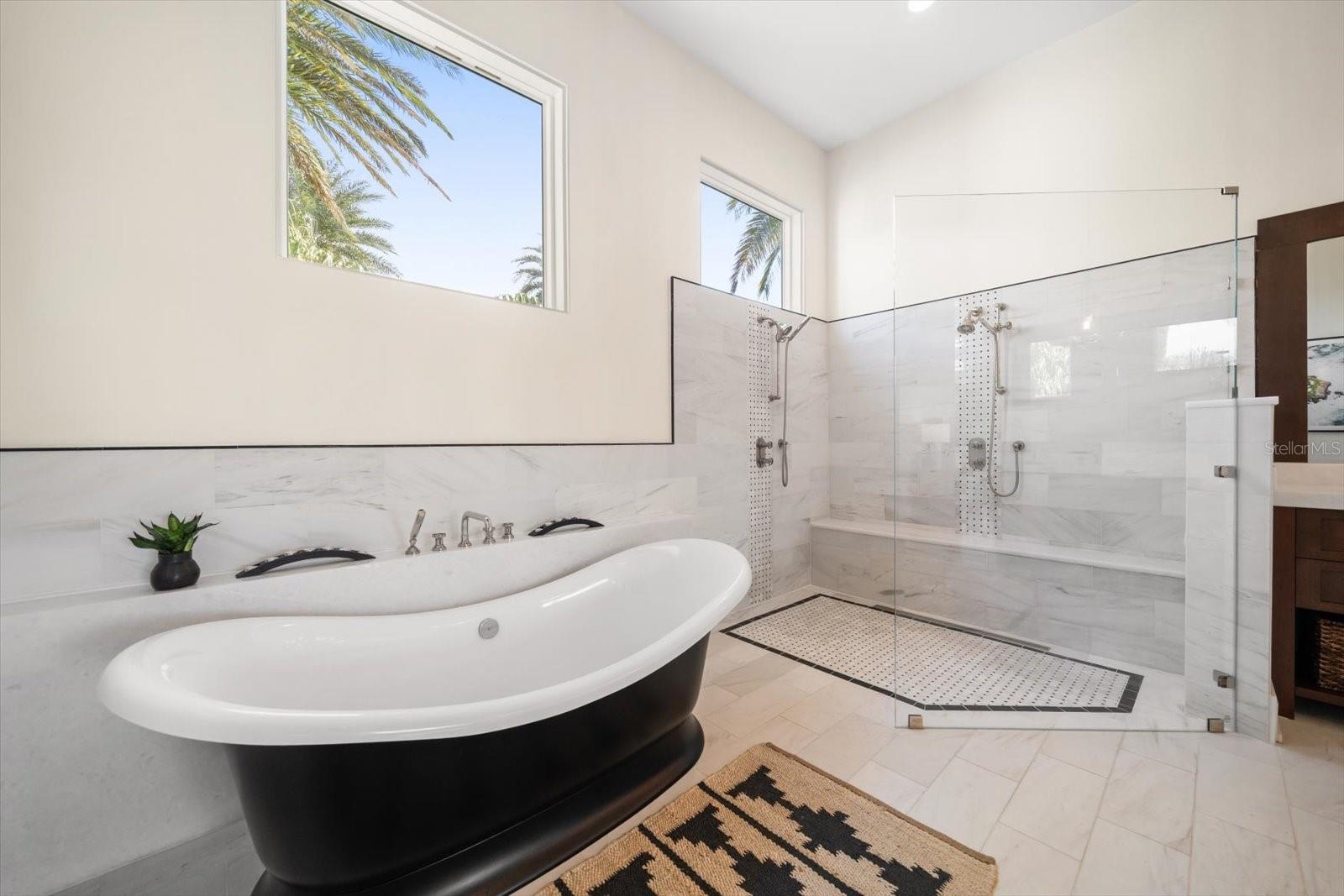 Victoria Albert soaking tub & zero entry walk in shower with bench seat & 2 showerheads