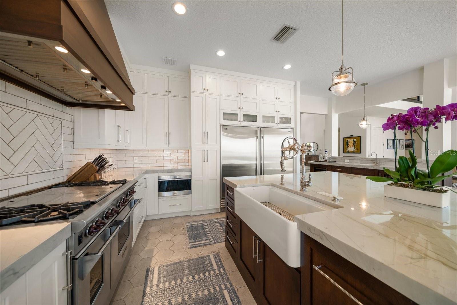 Farm sink with designer Waterstone Wheel faucet