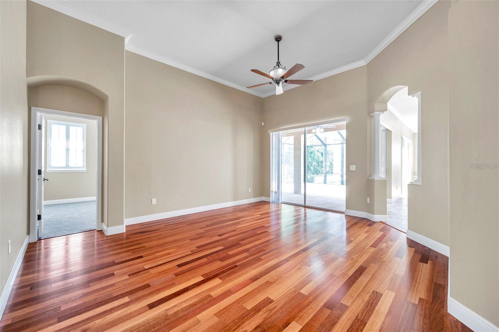Wood flooring - with primary suite entry in the background