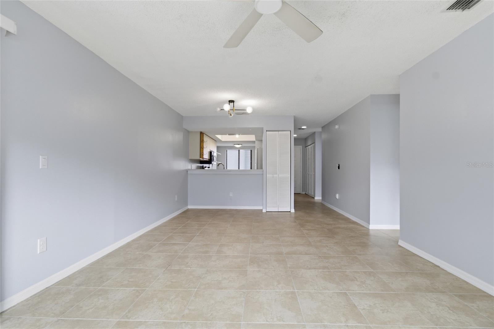 Living Room dining rm combo w/sliders to lanai