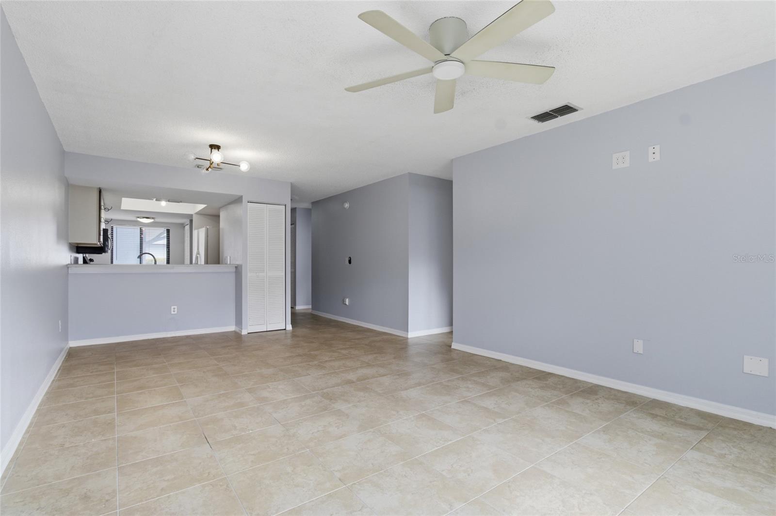 Living Room dining rm combo w/sliders to lanai