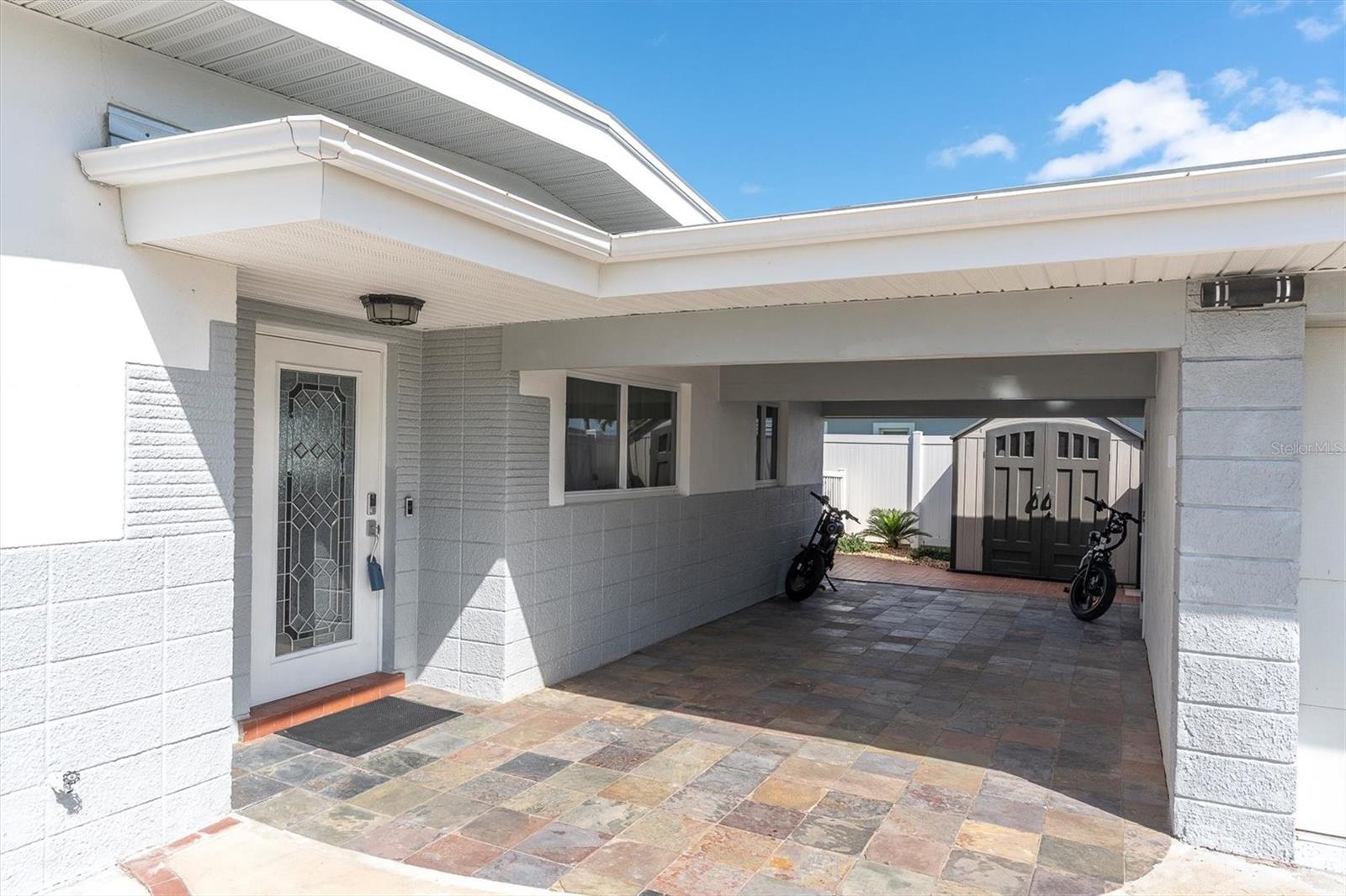 In additional to a one car garage the home also features a covered carport.