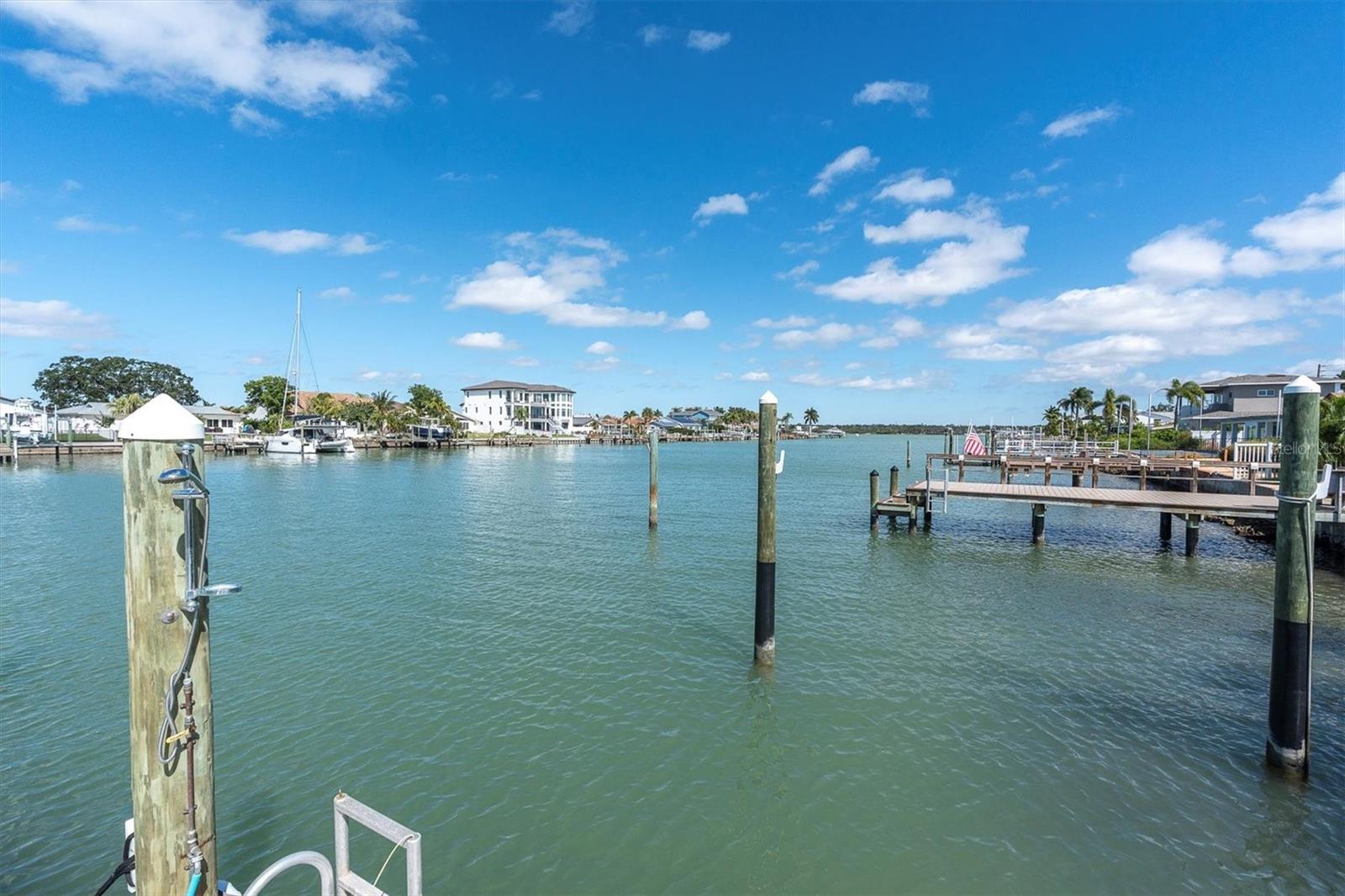 Perched on one of the widest channels on Treasure Island, this waterfront home offers unmatched beauty and lifestyle.