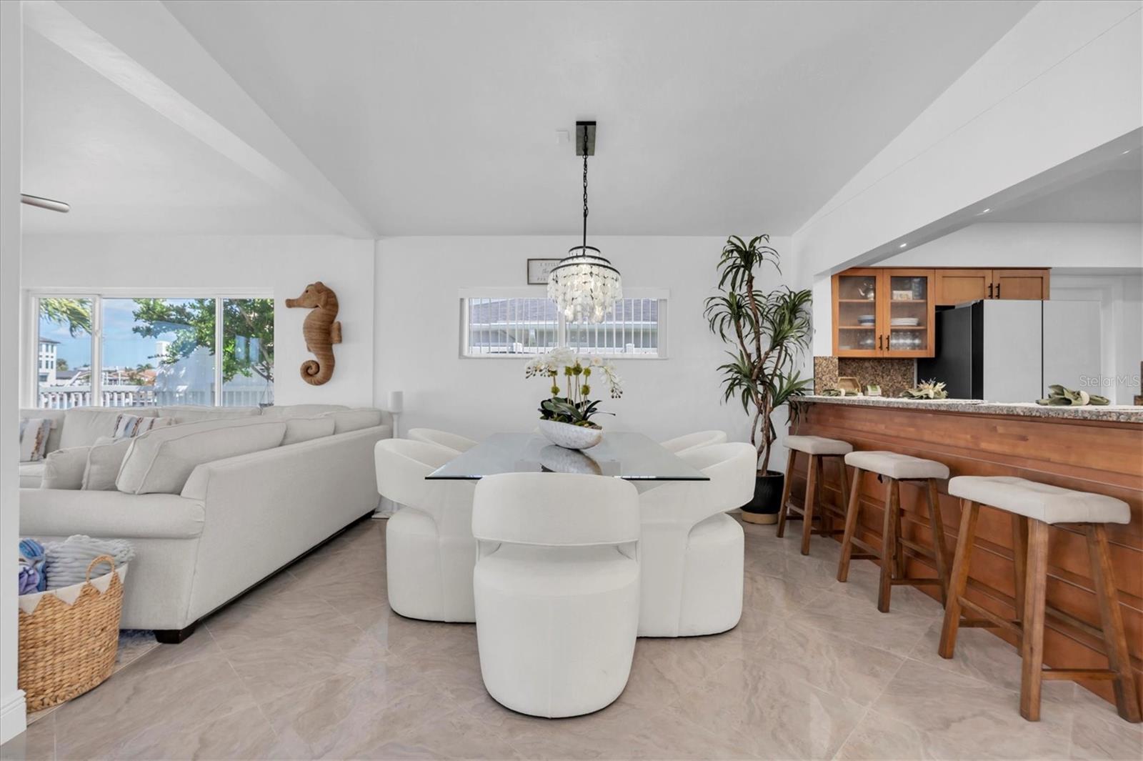 The open floor plan seamlessly connects living & dining, and kitchen areas, creating an ideal space for entertaining.