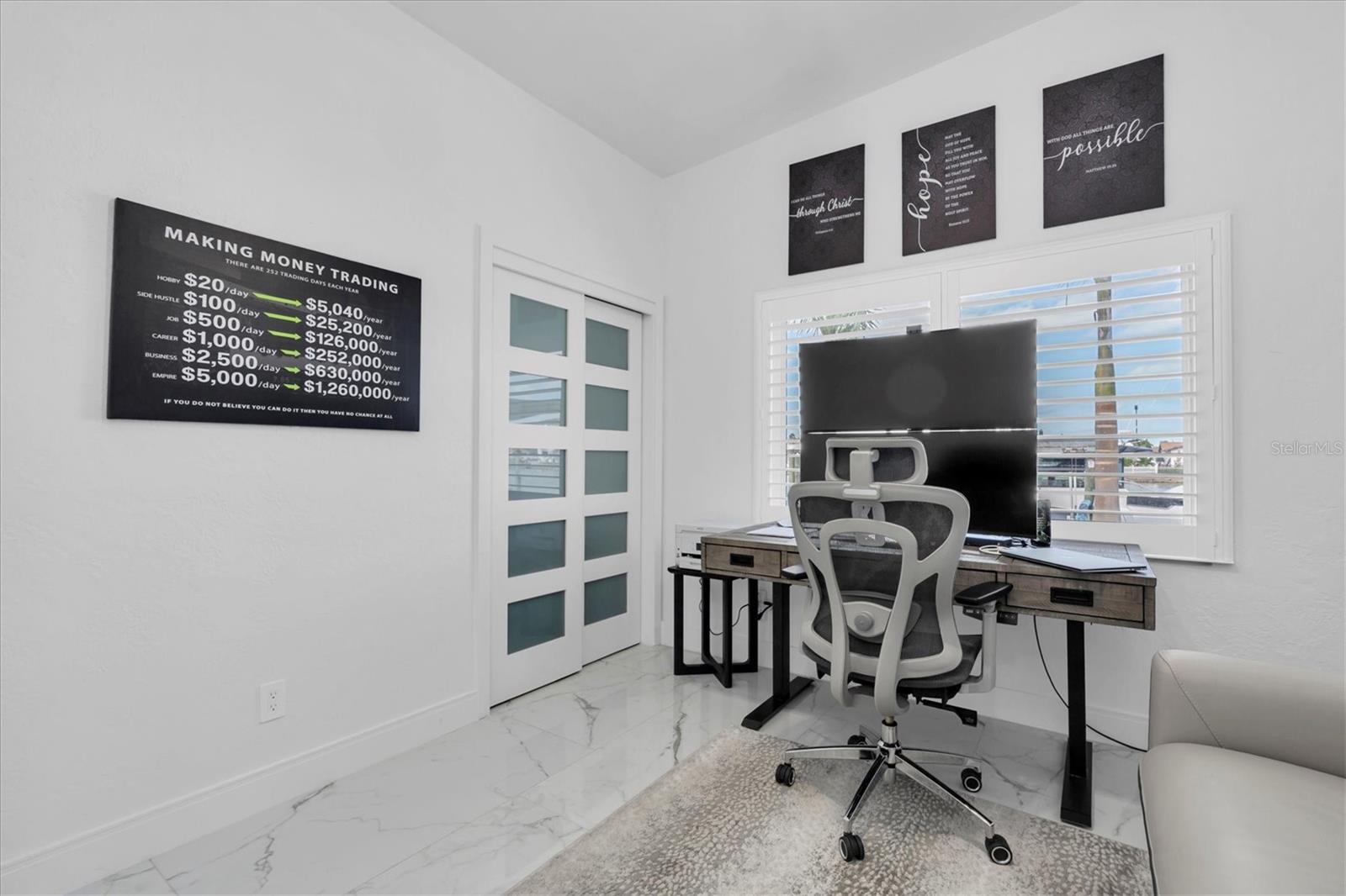 Currently used as an office, the fourth bedroom offers such spectacular water views it may be hard to stay focused!