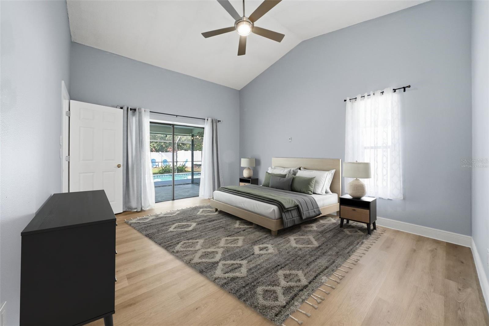 Virtually Staged Primary Bedroom with Pool View