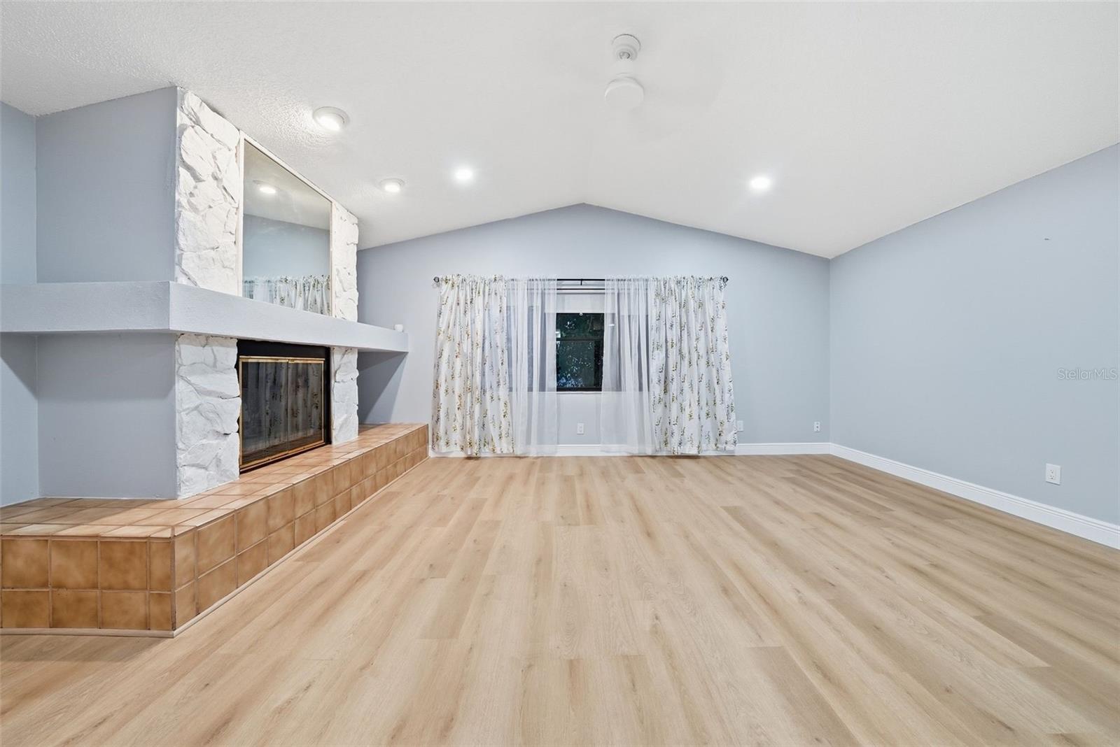 Living Room with Wood-Burning Fireplace