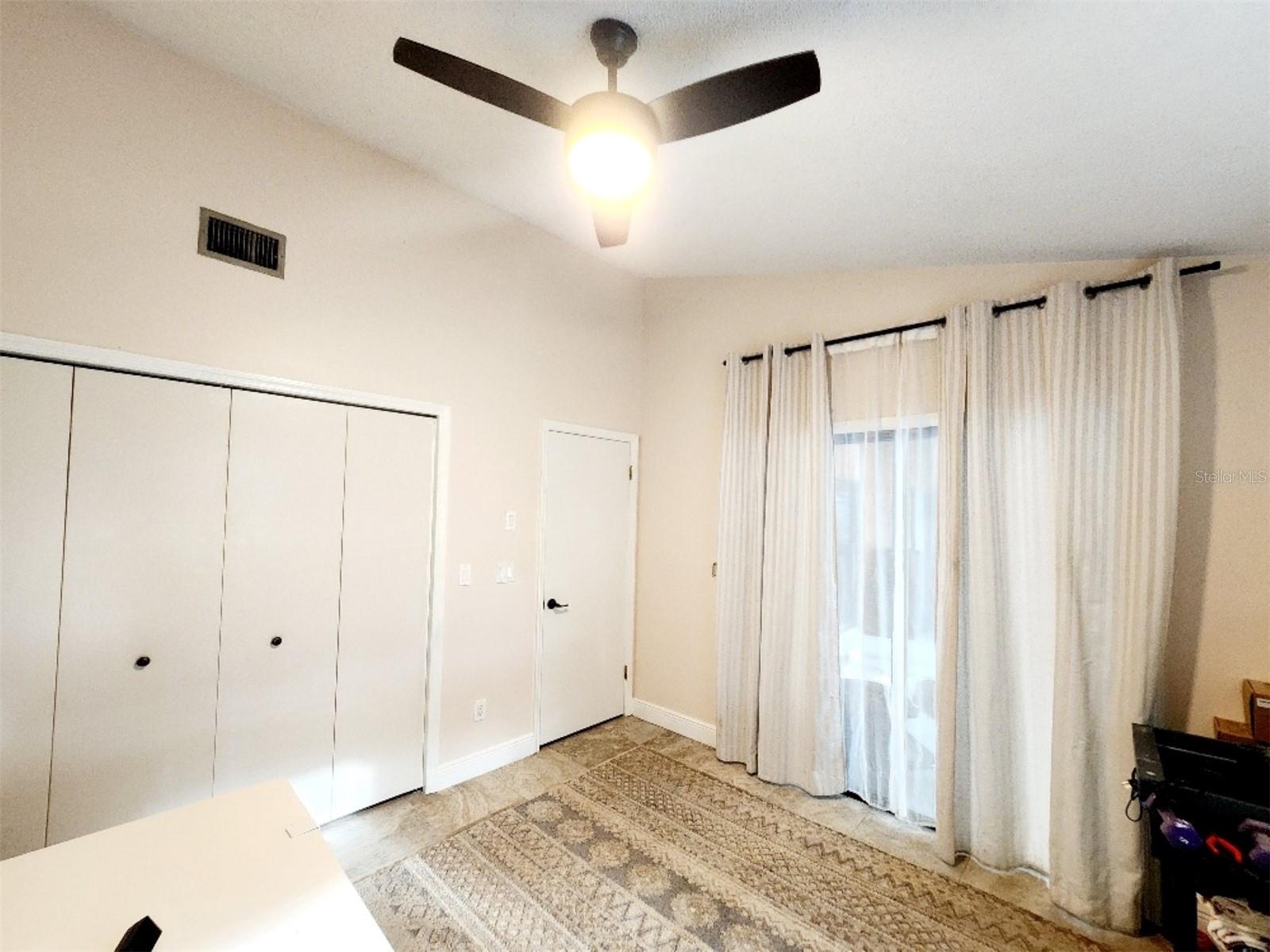 3rd bedroom with sliders to lanai