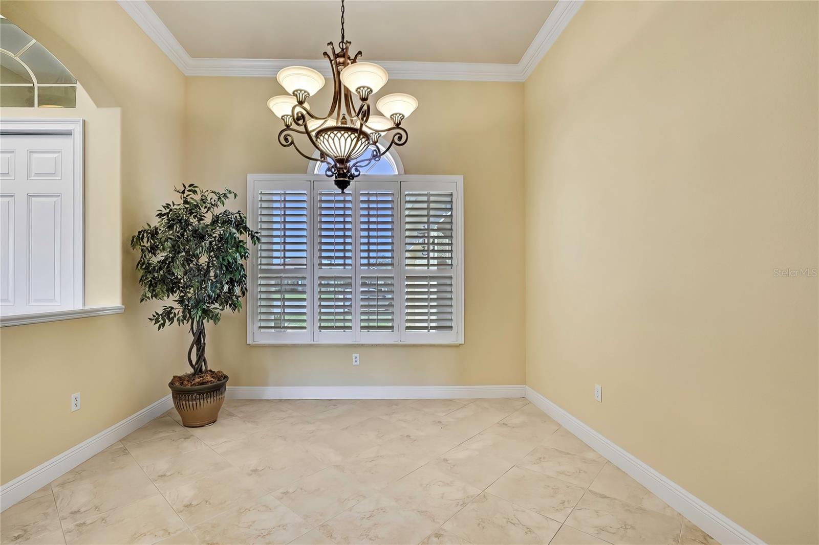 Dining Room with custom shutters and crown molding