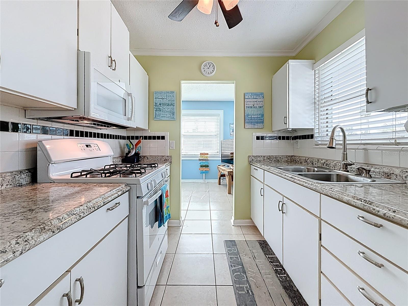 Your kitchen offers lots of counter space and notice the gas range.  Gas is part of your HOA fee