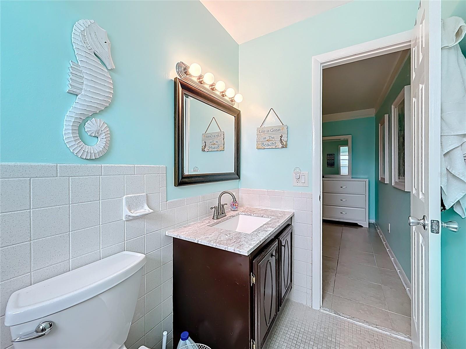 Notice the higher height vanity in the primary bath that offers lots of storage space underneath.