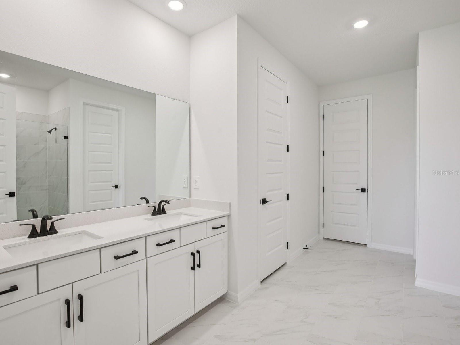 Interior photos are not of the actual home but are photos of the builder home with same floorplan with similar interior finishes and features.