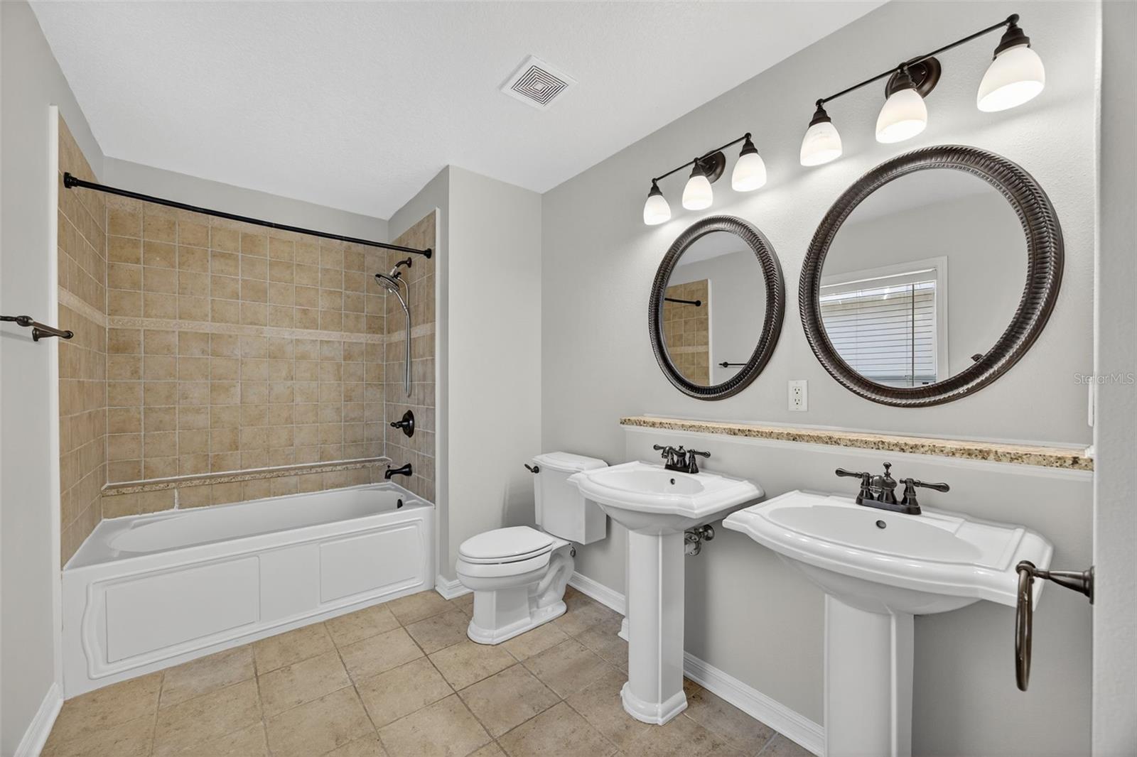 Primary bathroom with jetted tub and shower and a large linen closet