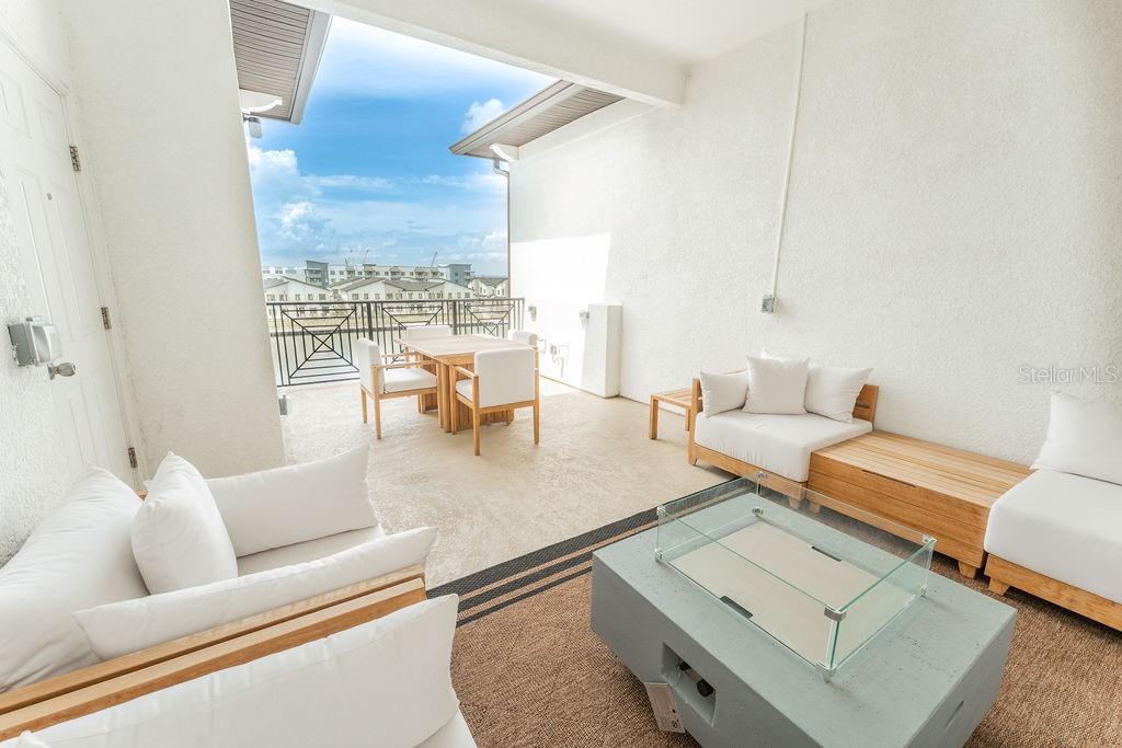 Spacious covered roof deck on the fourth floor.