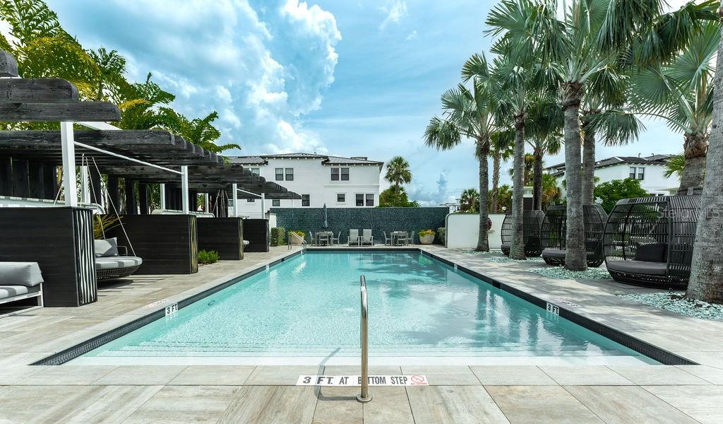 Spacious and beautiful community pool conveniently located near the residence.