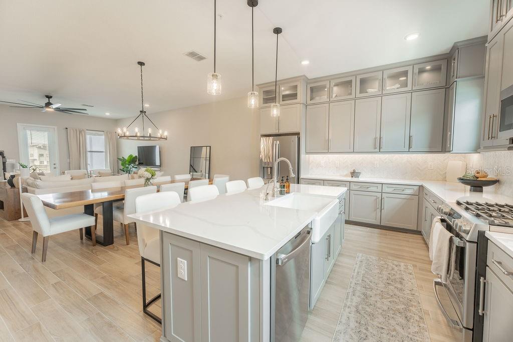 Open-concept kitchen on the second floor with access to the balcony.