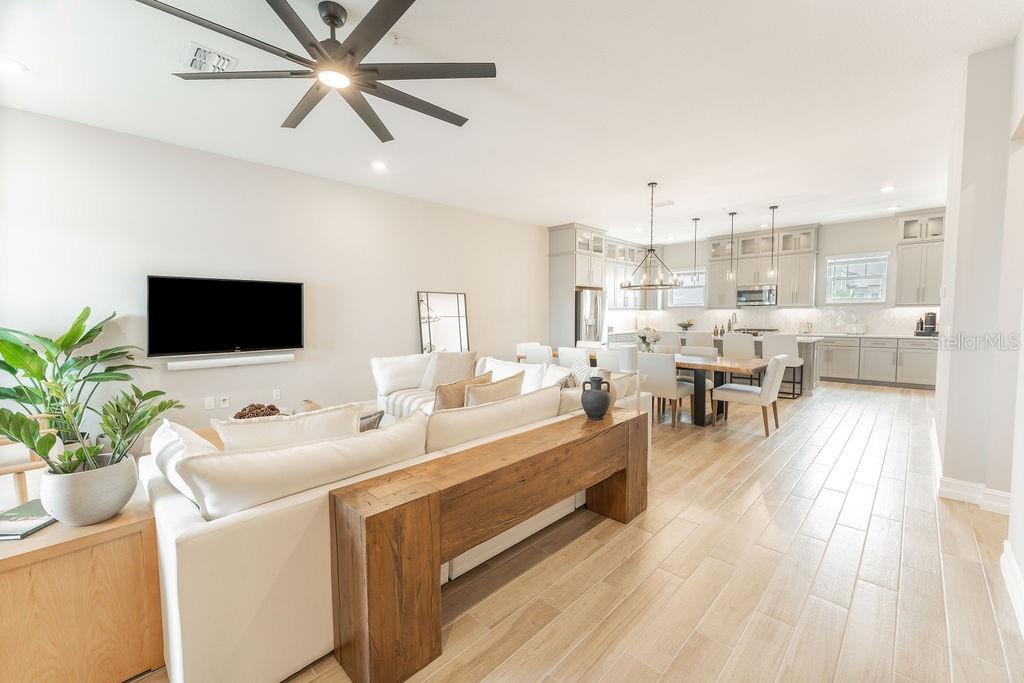 The second-floor entrance opens into a spacious, open-concept living area.