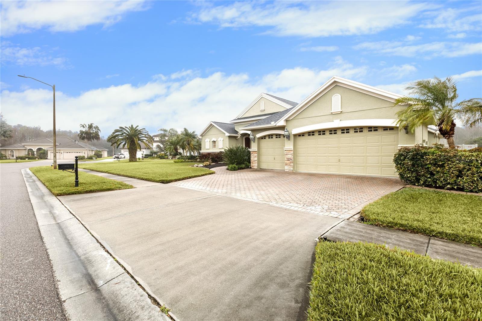 3 car garage and pavered driveway