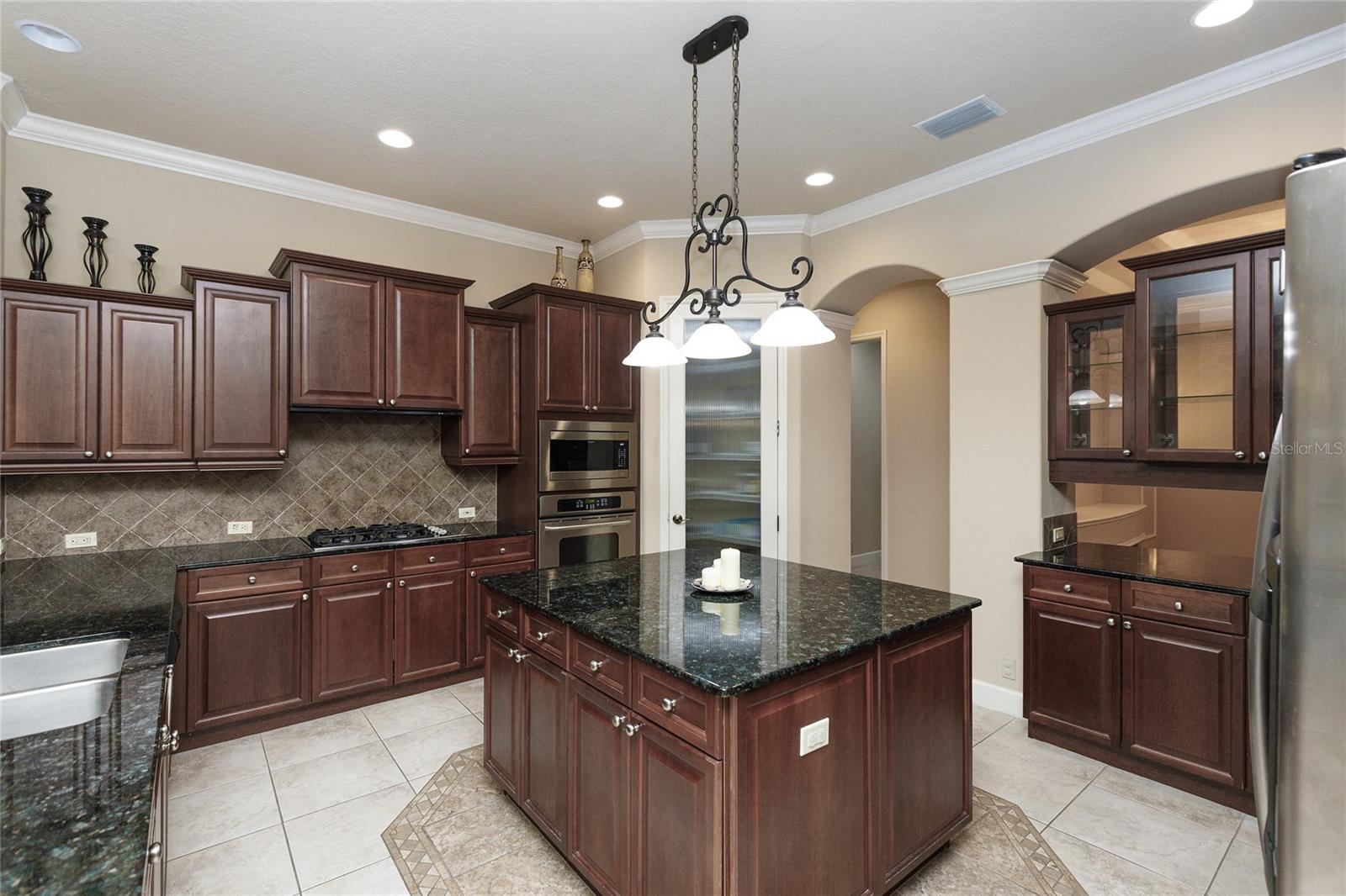 Kitchen with gas stove and large island