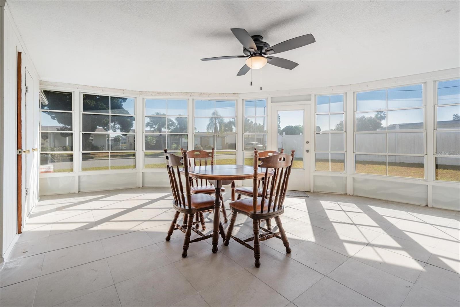 Enormous enclosed room with 2 closets. 1 closet has cedar siding. With slider windows and an exterior door.