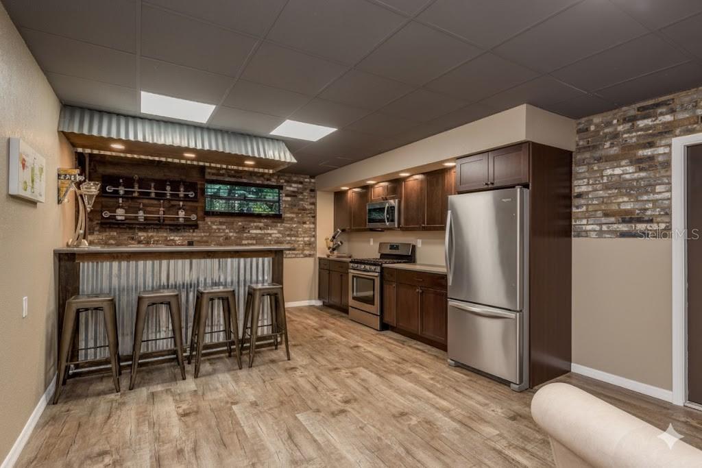 Virtually added a range and full refrigerator perfect for entertaining/multi-generational living!!