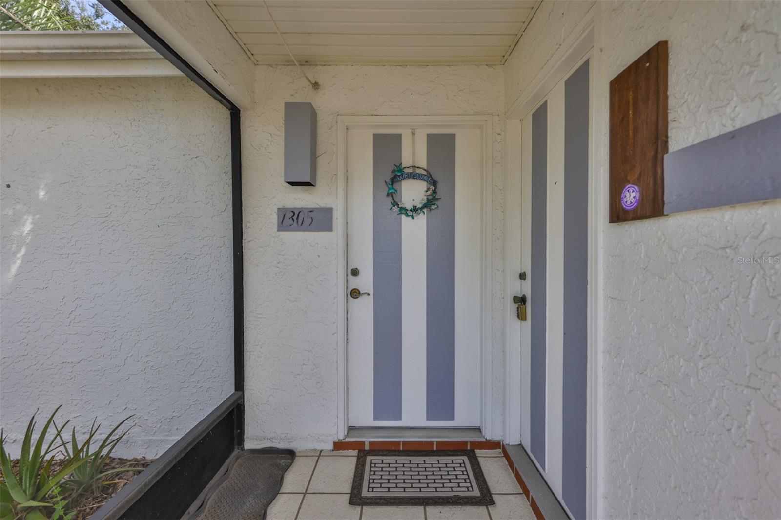 7.2 Screened front door (straight ahead) with private entry (to the right) to Primary Suite #1