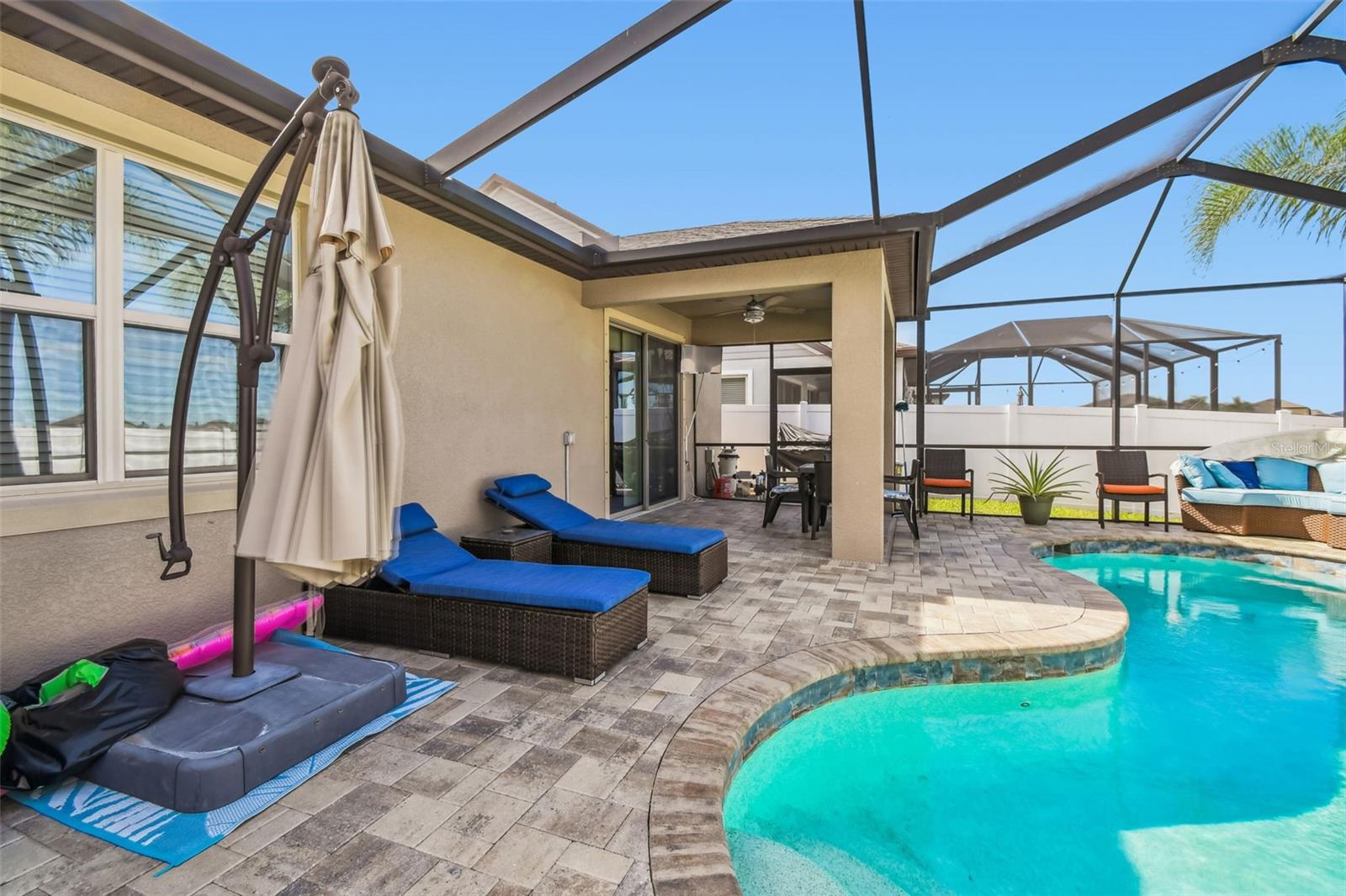 Pavers line the pool area