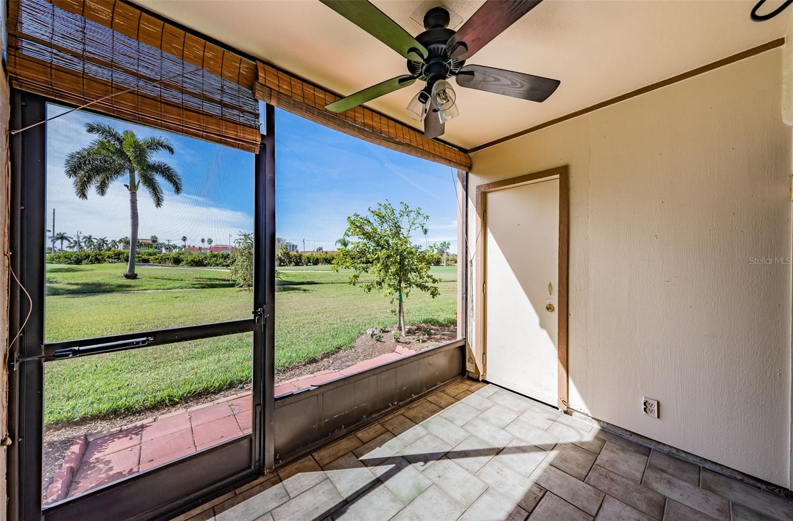 Private Screened Patio overlooks the Lush Green Golf Course